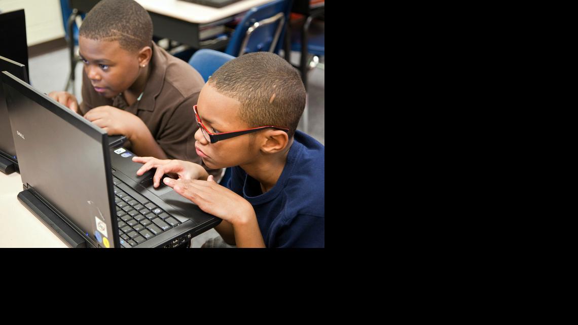 Clark Elementary students Jaylene Phillips, left, and Damacio Traylor work on an assignment.

