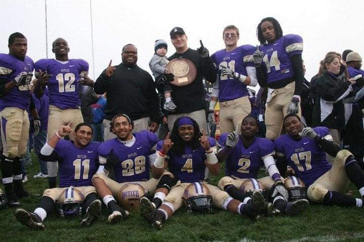 Zachary Miller (top row, second from left) poses with other Butler County College defensive backs and their defensive backs coach after the Citizen’s Bank Bowl victory over Trinity Valley in 2011.