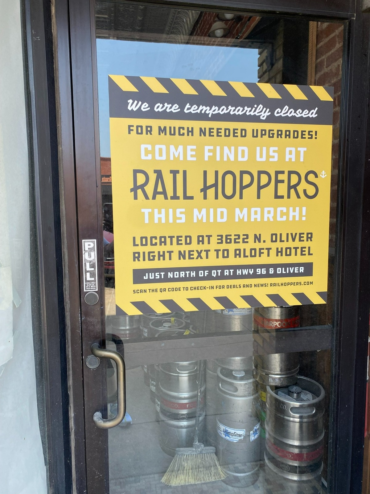 A sign on the door at The Anchor invites customers to try the owner’s other restaurant, Rail Hoppers, which opened in March.