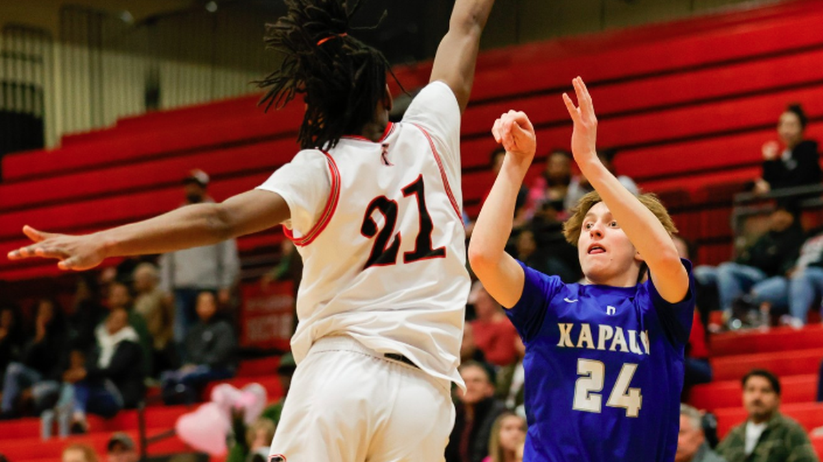 Kapaun Mt. Carmel senior Max Keller hit a 3-pointer to force overtime, then scored the game-winning basket to lift the Crusaders to a win over Heights to claim a share of the City League championship.