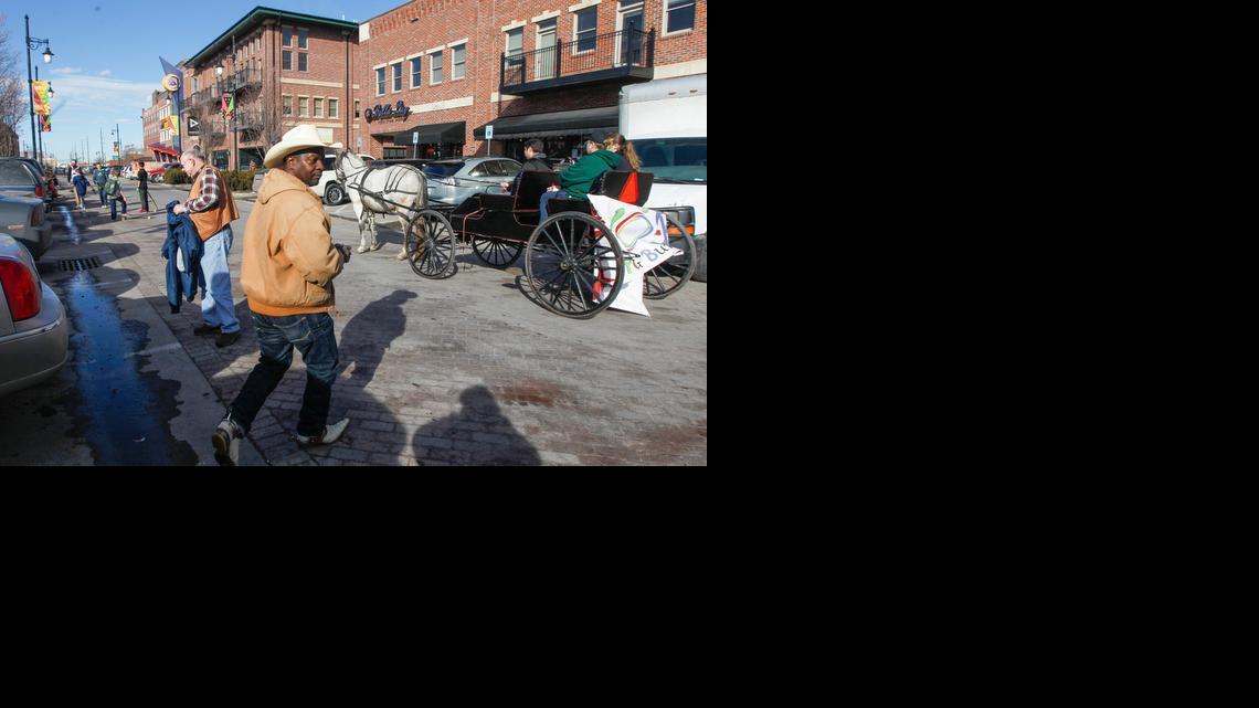 Shoppers visit Old Town Square. Old Town has more than 100 businesses, including restaurants, shops, clubs, theaters, galleries, museums, hotels and offices.

