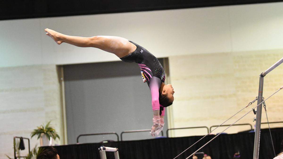 Augusta gymnast Keira Wells competes in the bars. She will compete for the OU women’s gymnastics team in college.