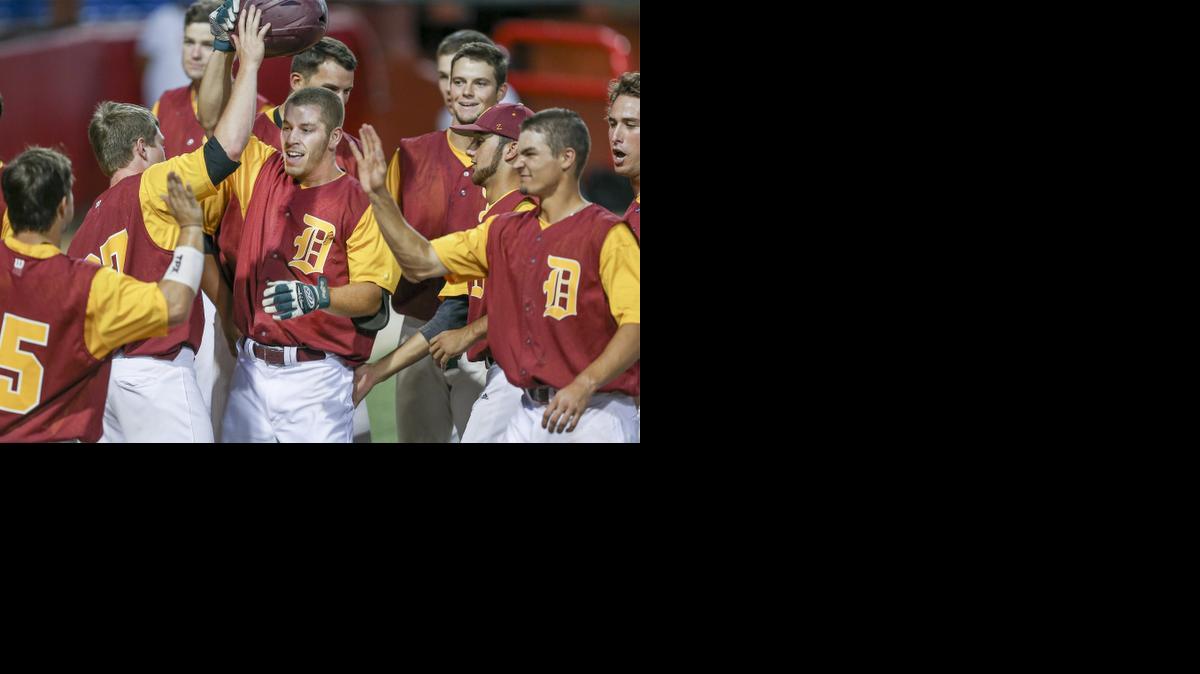 Derby Twins teammates greet Dylan Dillard, center, after his grand slam in the sixth inning against Jasper (Ind.) on Friday, the first night of the NBC World Series at Lawrence-Dumont Stadium.

