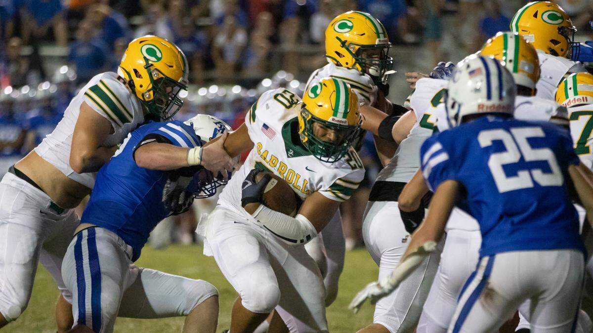 Bishop Carroll running back Jadonn Williams plows in for what turned out to be the winning score against Kapaun Mt. Carmel on Friday night at Cessna Stadium. Carroll has now beaten crosstown rival Kapaun for the 25th consecutive time.