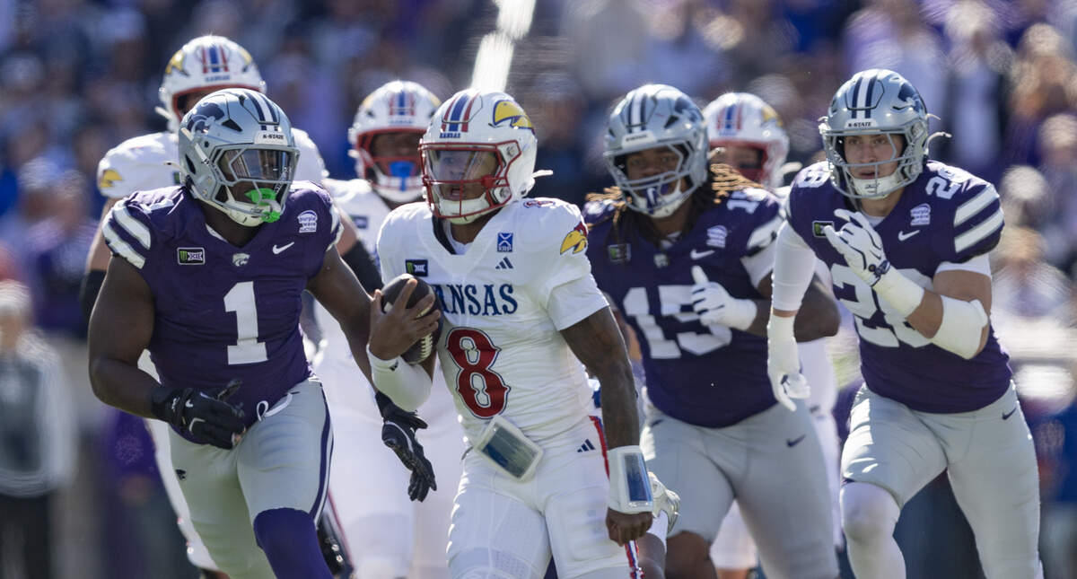 Kansas quarterback Isaiah Marshall picks up a long gain during the first half of the Jayhawks’ game against Kansas State in Manhattan on Saturday, Oct. 17, 2026.
