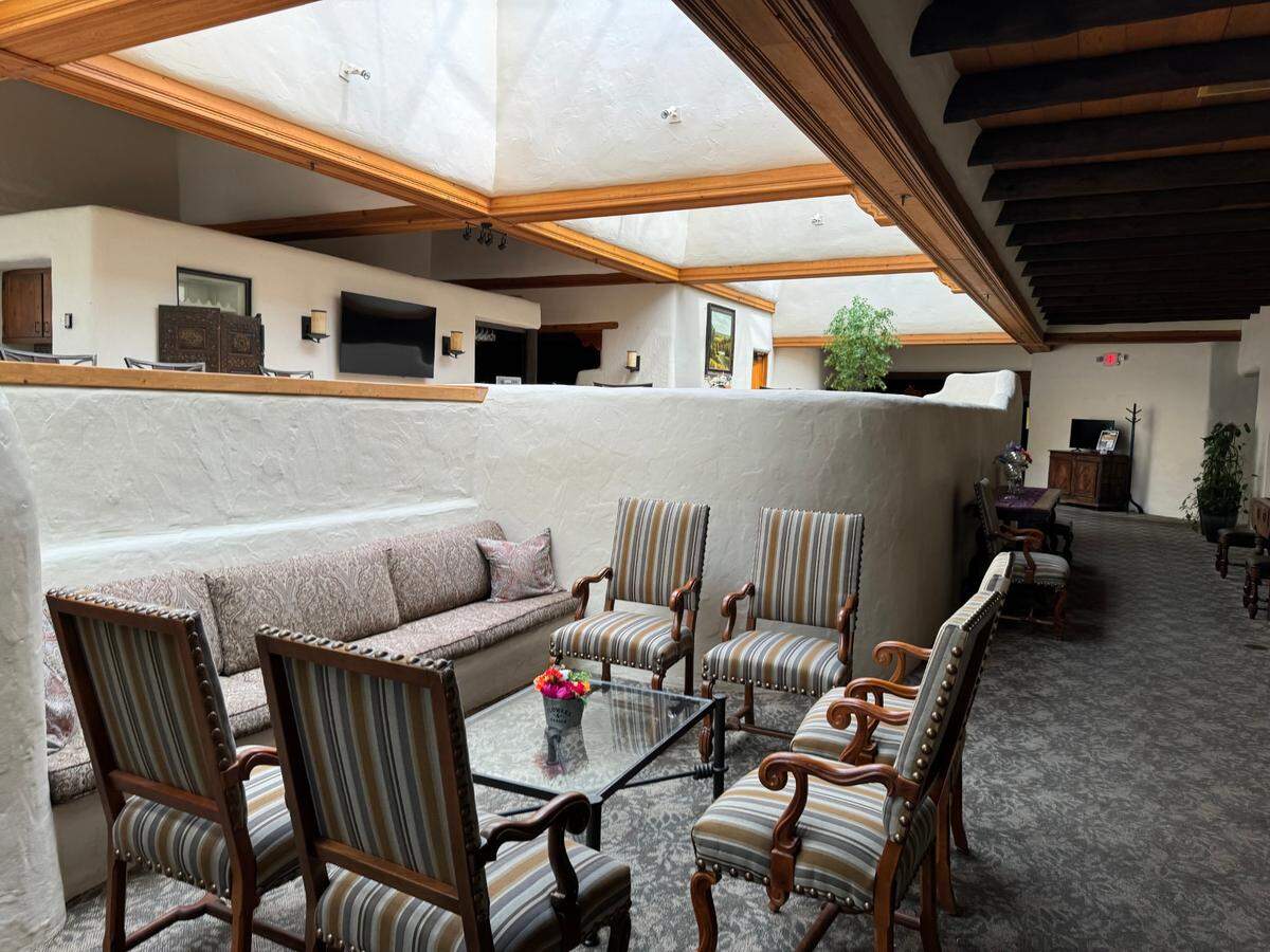 The original adobe-style walls in the lobby of The Petroleum Club will soon be removed so that the space can be opened up and modernized.