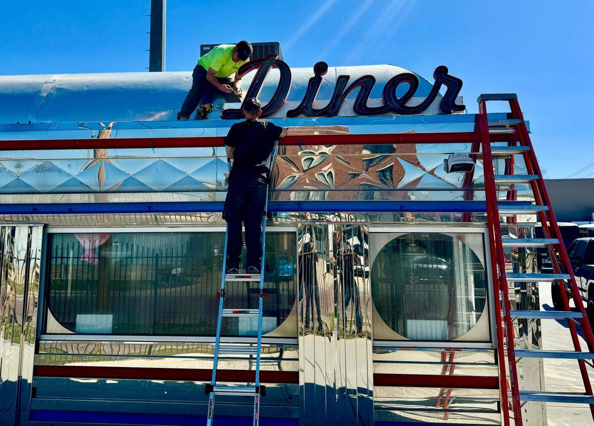 Station 8 owner installs vintage neon on his future diner