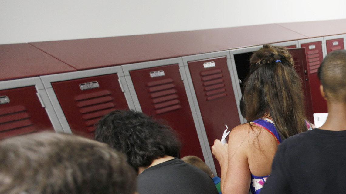 Christa McAuliffe Academy 6th-grade students practiced opening their lockers during orientation on Tuesday. (August 14, 2012) 



