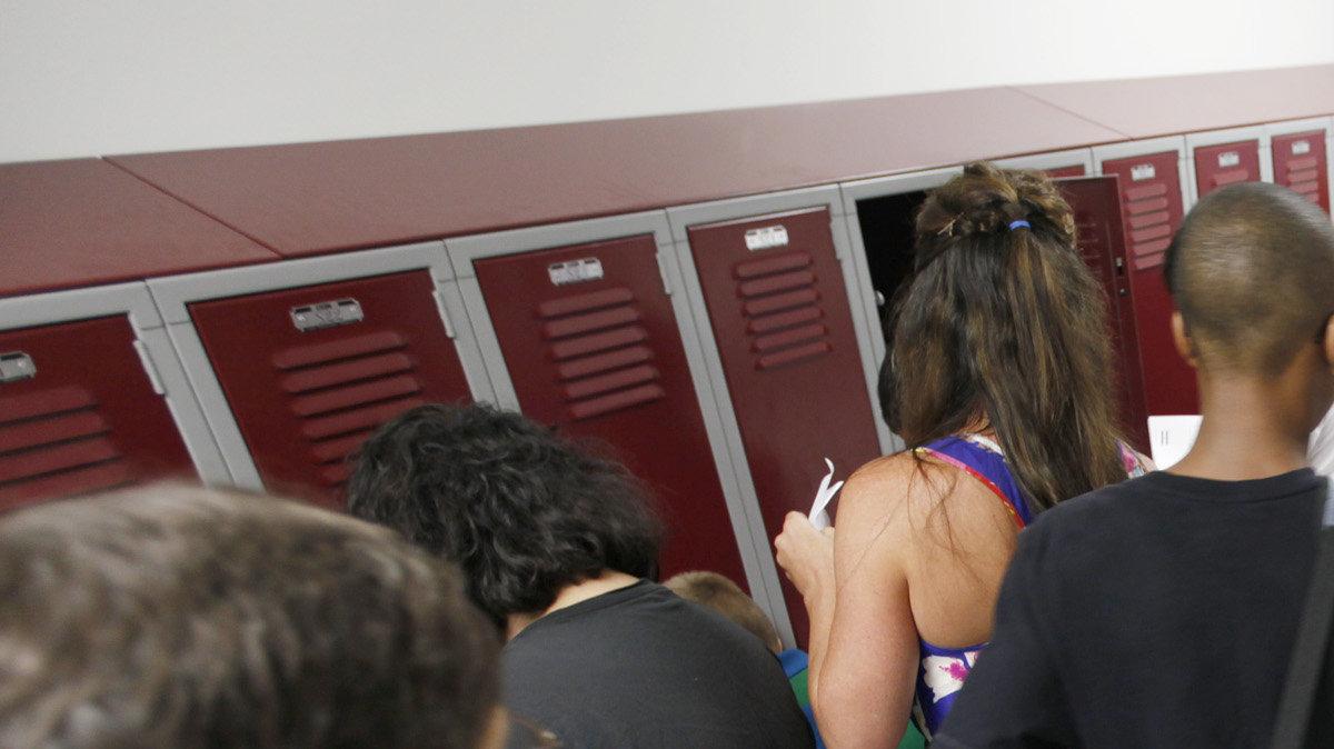 Christa McAuliffe Academy 6th-grade students practiced opening their lockers during orientation on Tuesday. (August 14, 2012) 


