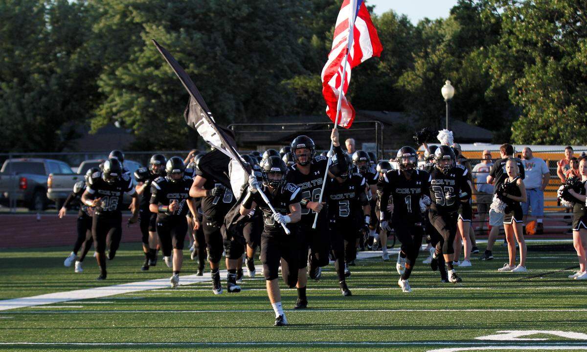 Campus runs onto the field for its game against Maize on Friday night. (Sept. 14, 2018)