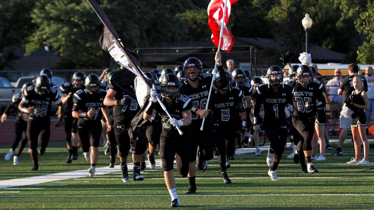 Campus runs onto the field for its game against Maize on Friday night. (Sept. 14, 2018)