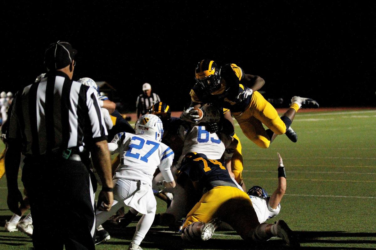 Wichita Northwest’s Breece Hall leaps into the end zone for his fifth touchdown in the Grizzlies 55-26 win over Kapaun on Friday. (Sept. 28, 2018)