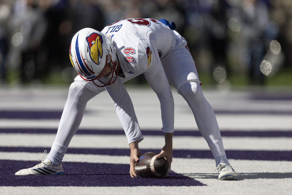 Kansas punter Matthew Gill fumbled a snap which resulted in a safety during the first half of their against Kansas State game in Manhattan on Saturday.