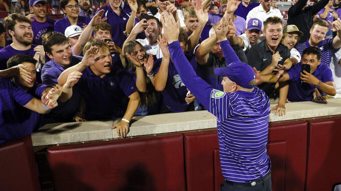 Kansas State coach Chris Klieman celebrates with fans after the team’s 41-34 win over Oklahoma in an NCAA college football game Saturday, Sept. 24, 2022, in Norman, Okla. (AP Photo/Nate Billings)