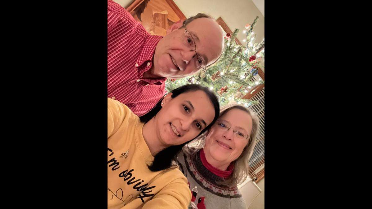Mariana Christian with John and Debbie Matthew around the holidays.