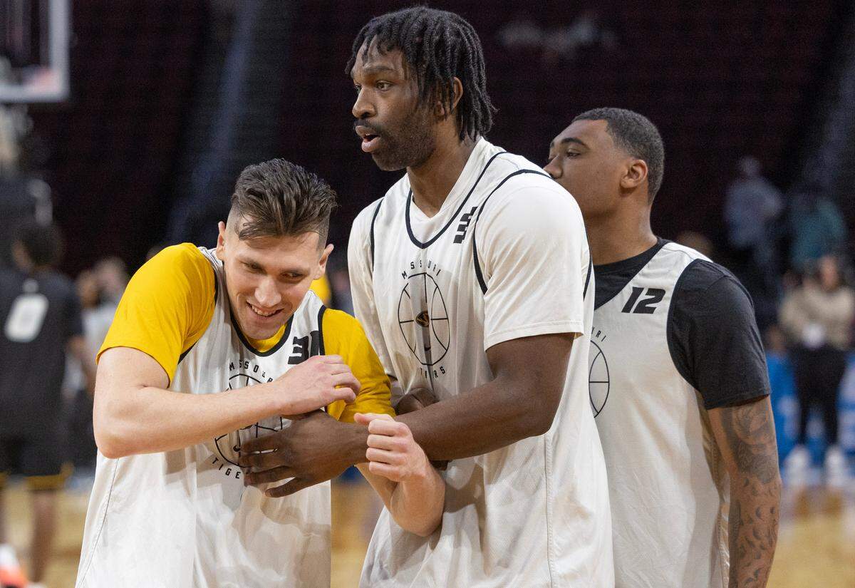 Missouri’s Caleb Grill, left, messes around with teammates during the team’s open practice on Wednesday, March 19, 2025, in Wichita. Grill played at nearby Maize High School.