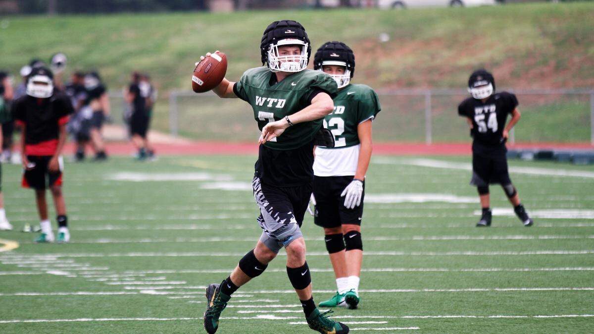 Derby’s Grant Adler looks for a receiver downfield during the Panthers’ fall practice.