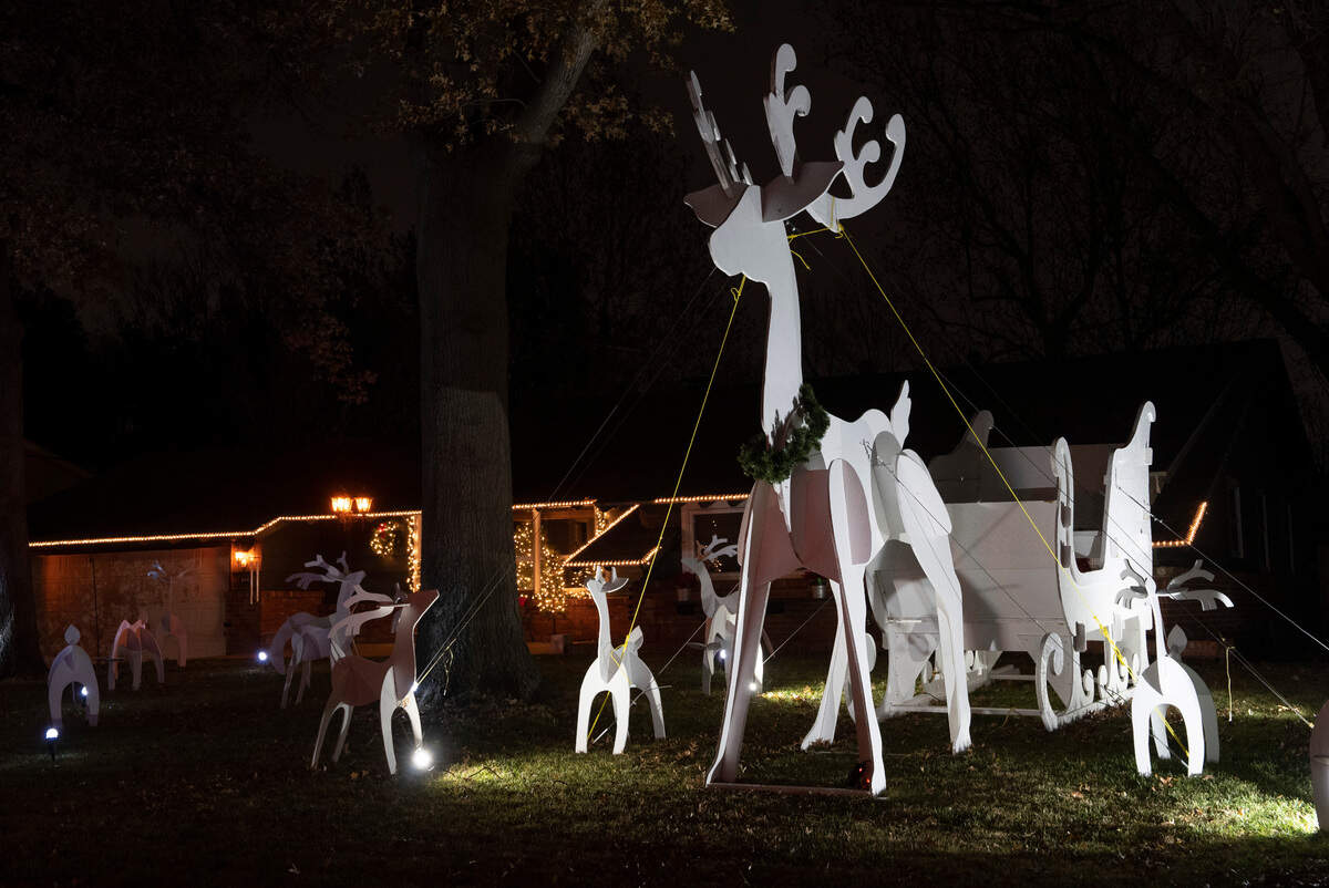 An impressive collection of wooden reindeer fill the yard at 846 N. Crestline. The popular Christmas on Crestline light show is a few doors down at 914 N. Crestline.