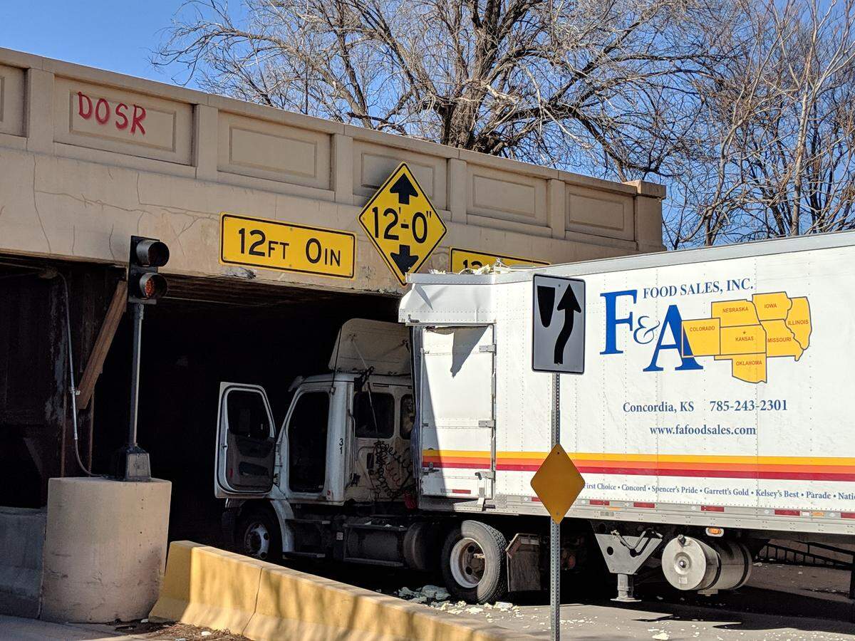Another one bites the dust. This is one in a long line of photos that businessman Bruce Rowley has shot of the “truck-killing bridge” near his office along Waterman. Truck drivers either don’t seem to notice or believe the warning signs that vehicles over 12 feet can’t pass.