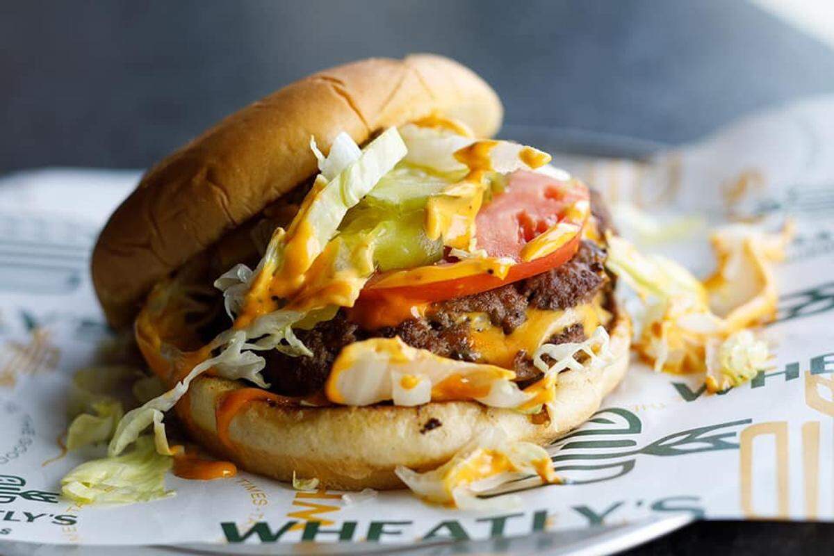 A Wheatly’s burger at Social Tap Drinkery at Wichita State University. By late summer, Social Tap’s burgers, pizzas and drinks will be available at Andover’s Heritage Square.