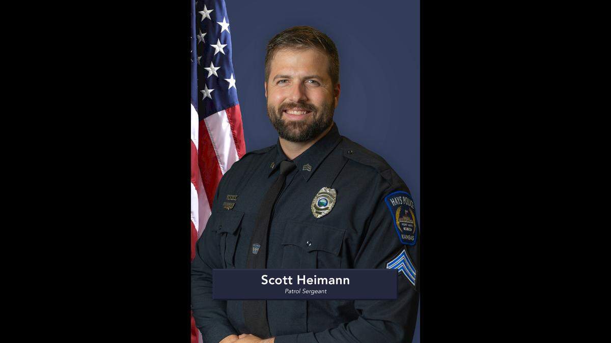 Hays police Sgt. Scott Heimann died Sunday after he was shot by a barricaded suspect.