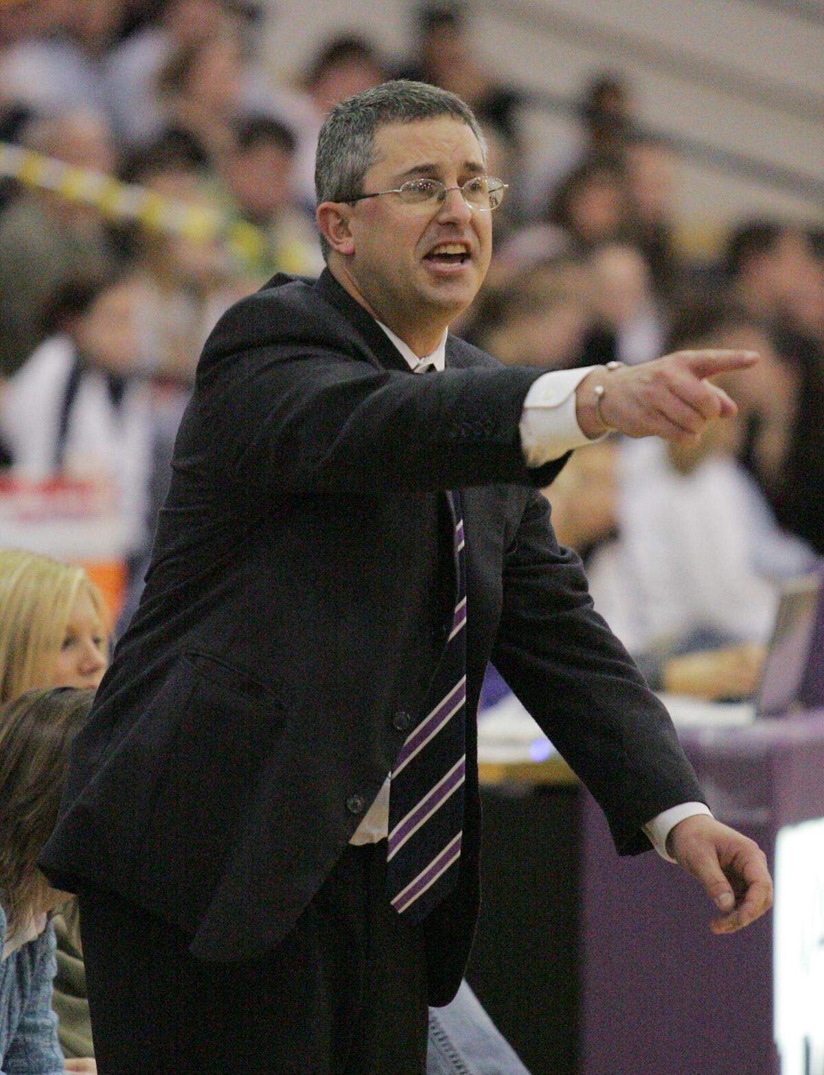 Valley Center girls head coach Ted Anderson gives instructions to his team in the game against Newton on January 13, 2006.