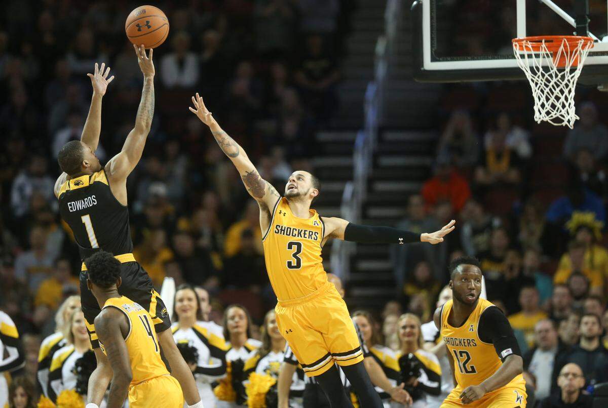 Wichita State guard Ricky Torres defends Southern Miss guard Cortez Edwards during the second half of their game at Intrust Bank Arena on Saturday.