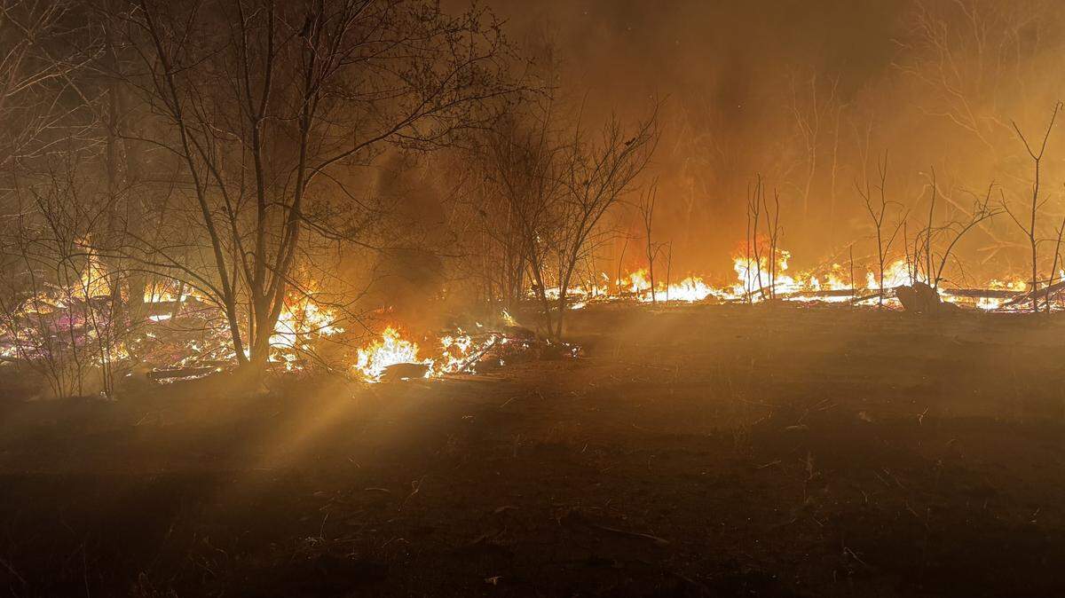 A large brush fire reported at the abandoned Joyland Amusement Park was contained by crews who worked overnight to ensure no further fire spread throughout the park.