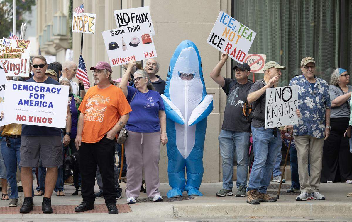 Some of the protesters at the “No Kings” demonstration in Wichita on Saturday afternoon wore inflatable&nbsp;costumes