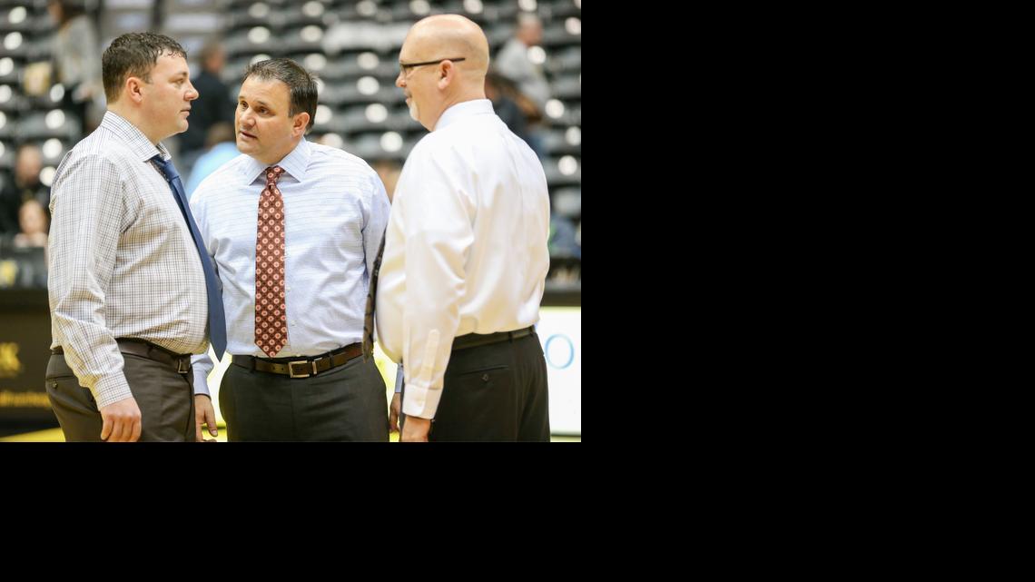 WSU assistant coaches Greg Heiar, left, Chris Jans and Steve Forbes talk prior to the March 1 Missouri State game. All are from Iowa with junior-college coaching backgrounds.


