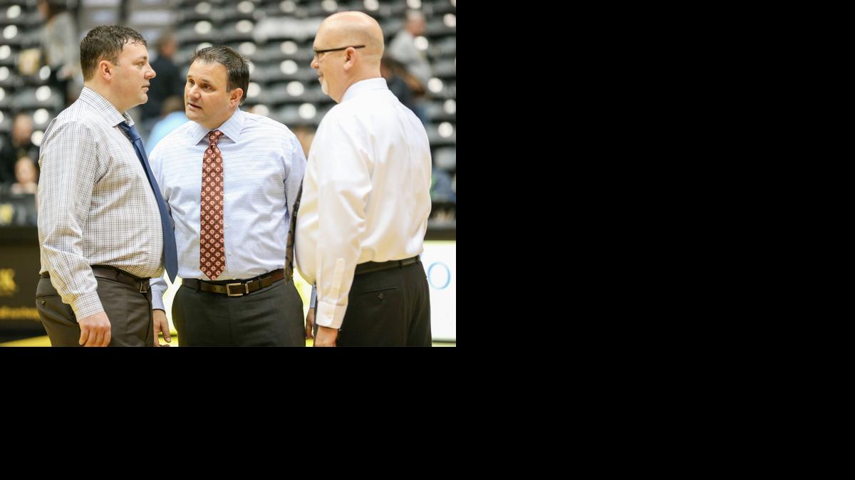 WSU assistant coaches Greg Heiar, left, Chris Jans and Steve Forbes talk prior to the March 1 Missouri State game. All are from Iowa with junior-college coaching backgrounds.

