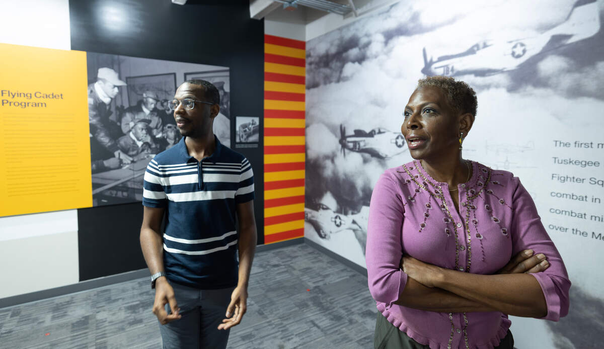 Bonita Gooch, daughter of the late Rip Gooch, and her nephew, Kerry Gooch, Rip Gooch’s grandson, got a sneak peek of the new Rip Gooch Black Aviators Exhibit at the Kansas Aviation Museum. The exhibit opens to the public on Friday.