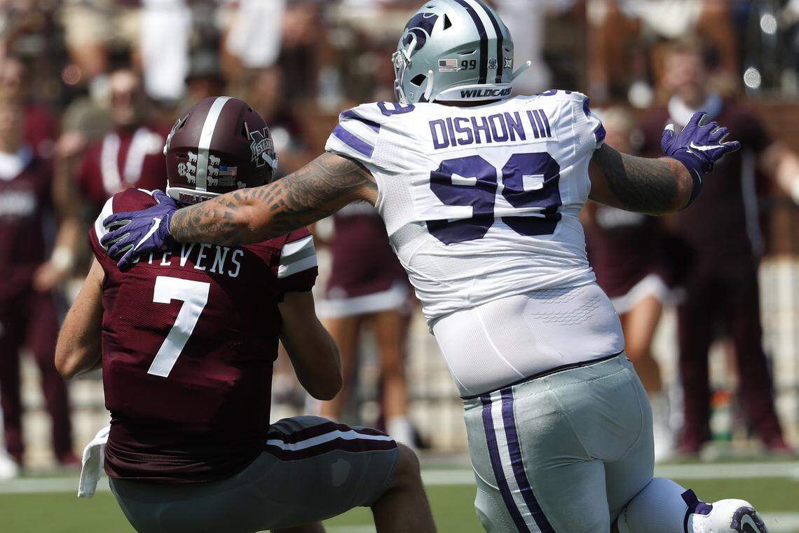 Mississippi State quarterback Tommy Stevens (7) is sacked by Kansas State Trey Dishon (99) during the first half of their NCAA college football game in Starkville, Miss., Saturday, Sept. 14, 2019. (AP Photo/Rogelio V. Solis)