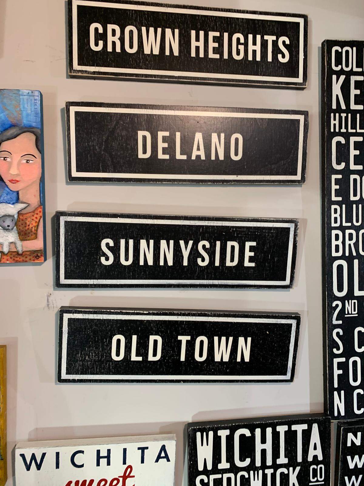 The Workroom has a nice selection of neighborhood wall hangings.