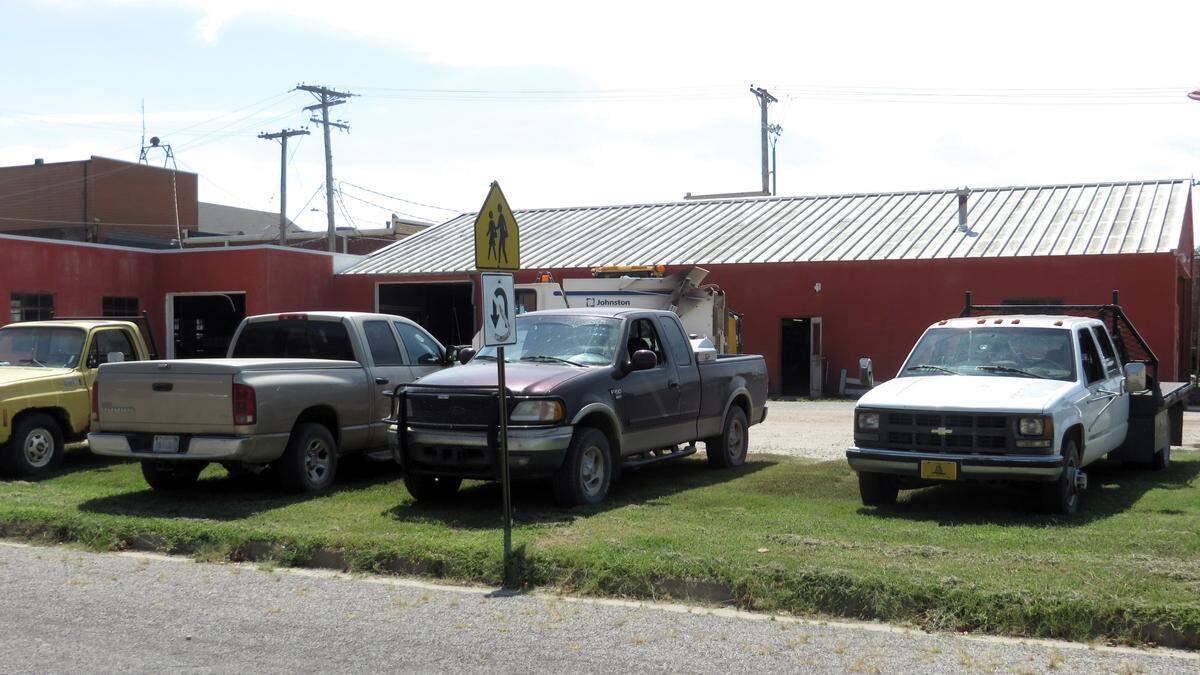 Employees park on the grass at the city of St. John maintenance facility, across the street from where Mike Rosseau and Dorothy Tobe are being criticized for parking on grass.