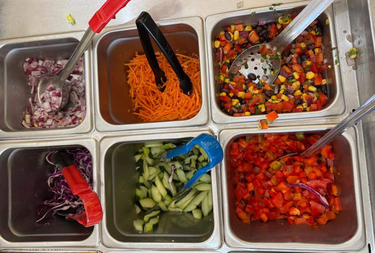 Express Kitchen at 725 E. Douglas features a bar full of ingredients customers choose from to assemble bowls, wraps and salads.
