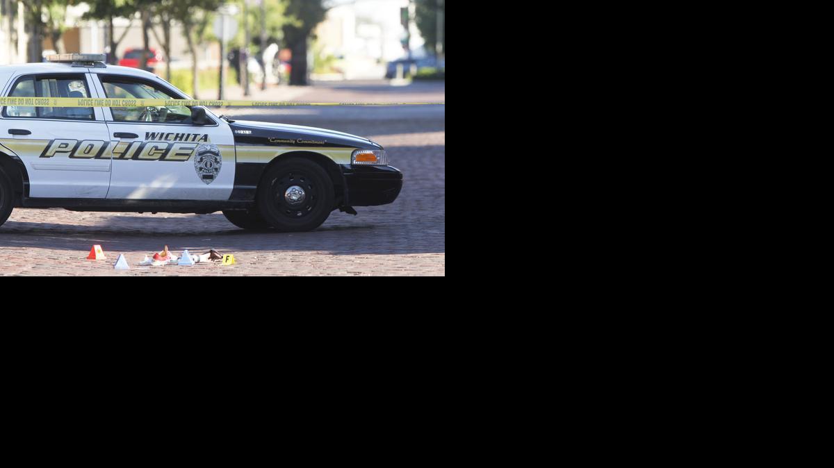 Evidence marked by the Wichita police lies in the 100 block of Mead in Old Town. A shooting occurred there early Sunday morning leaving six people injured and one dead. (Sept. 22, 2013)

