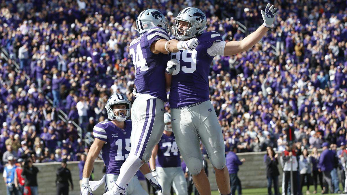 K-State running back Alex Barnes (34) celebrates with K-State tight end Blaise Gammon (89) after scoring another touchdown against Oklahoma State.(October 13, 2018)