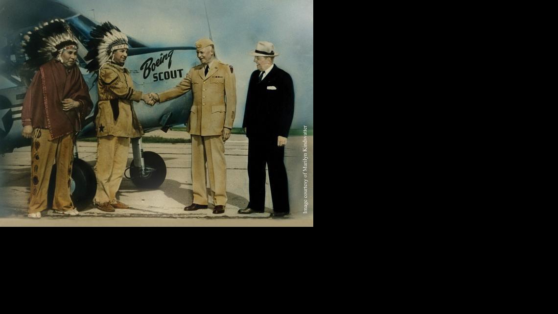 This photograph, taken in 1951, shows President Dwight D. Eisenhower and Boeing Leader J. Earl Schaefer in Wichita with Francis Stumblingbear (Kiowa) and Gordon Bushyhead (Cherokee) in front of the Boeing Scout plane they helped build. The photo is on loan to the Indian Center from the personal collection of Wichitan and Cherokee Elder Marilyn Kindsvatter, Gordon Bushyhead’s daughter.

