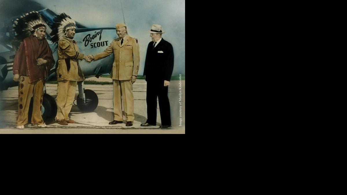 This photograph, taken in 1951, shows President Dwight D. Eisenhower and Boeing Leader J. Earl Schaefer in Wichita with Francis Stumblingbear (Kiowa) and Gordon Bushyhead (Cherokee) in front of the Boeing Scout plane they helped build. The photo is on loan to the Indian Center from the personal collection of Wichitan and Cherokee Elder Marilyn Kindsvatter, Gordon Bushyhead’s daughter.

