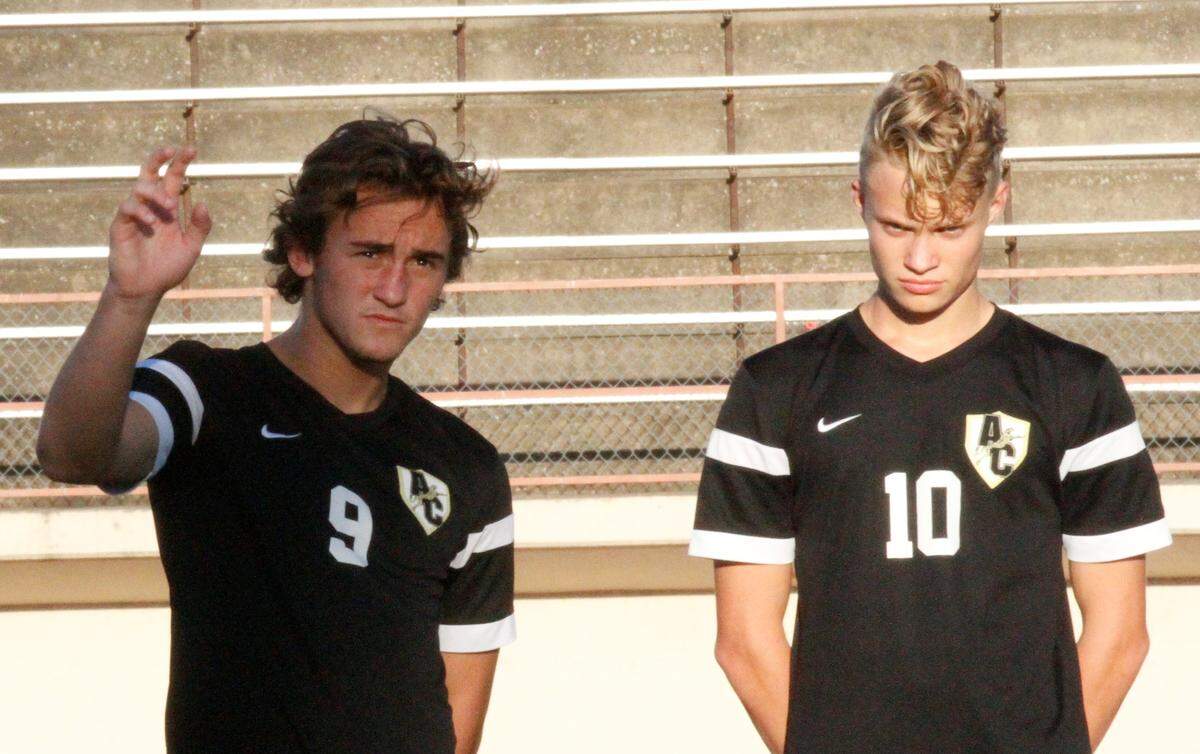 Andover Central junior forwards Jadyn Vosser (9) and Leyton Harper (10) are introduced befor the Jaguars’ game against Campus on Tuesday. (Sept. 11, 2018)