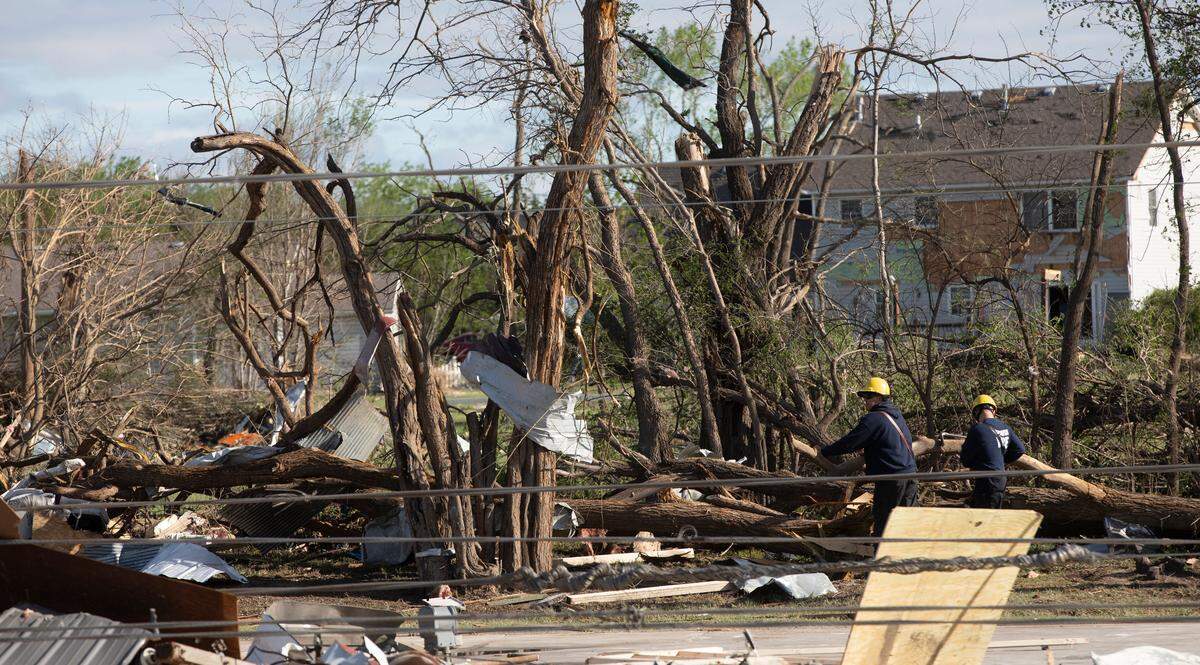 Wichita firefighters search whatÕs left of JohnÕs Animal World after a tornado hit it on April 29, 2022. This building is directly north of the Andover YMCA. (April 30, 2022)