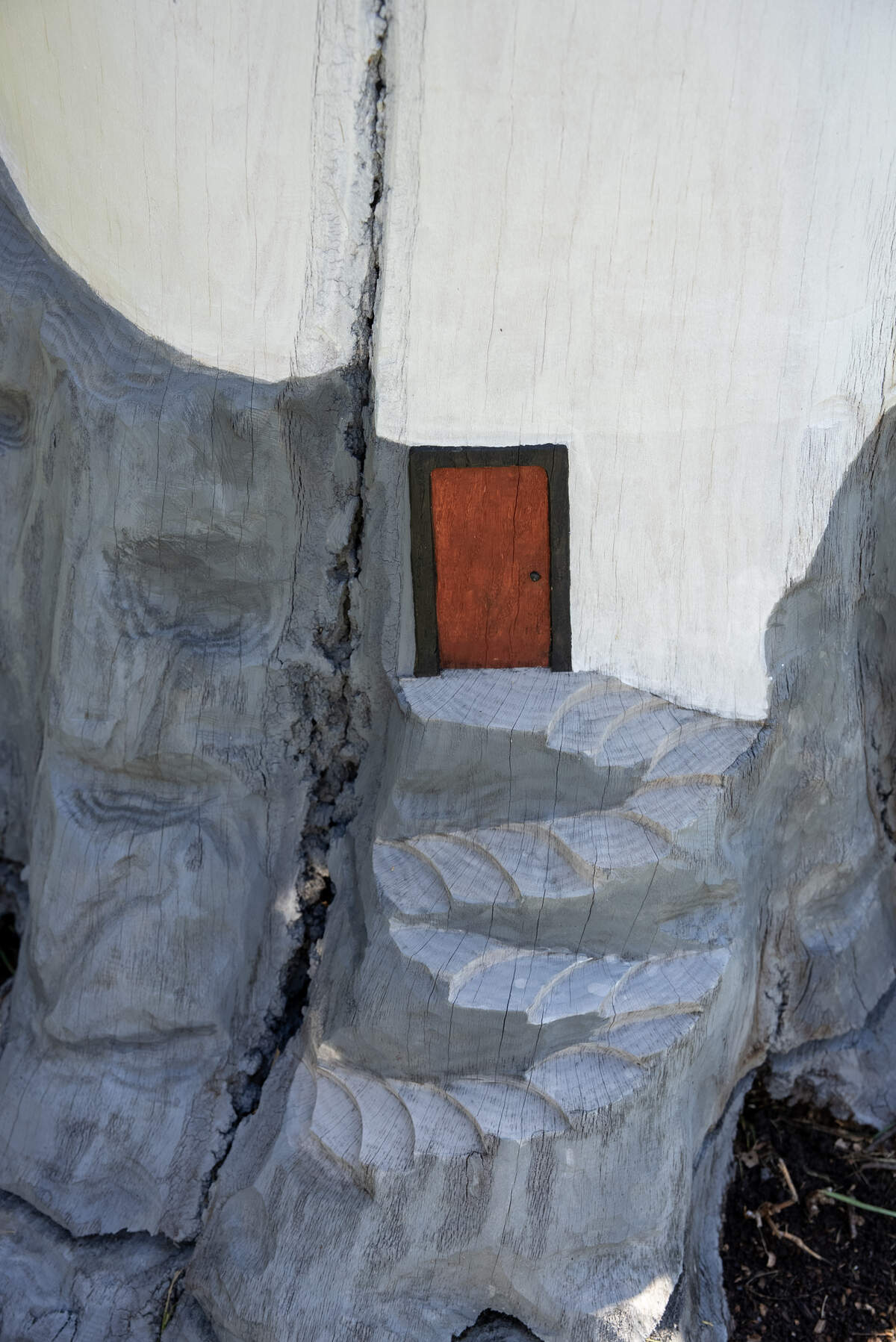 At the base of the lighthouse that Daniel Dossett carved is a tiny door and stairs that lead to it.