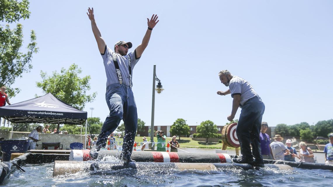 Log rollers compete in the Paul Bunyan Lumberjack Show during the Wichita River Festival on Saturday. The Lumberjack show continues daily at 5:30 and 7:30 p.m. with additional performances at 2 p.m. on Friday and Saturday.