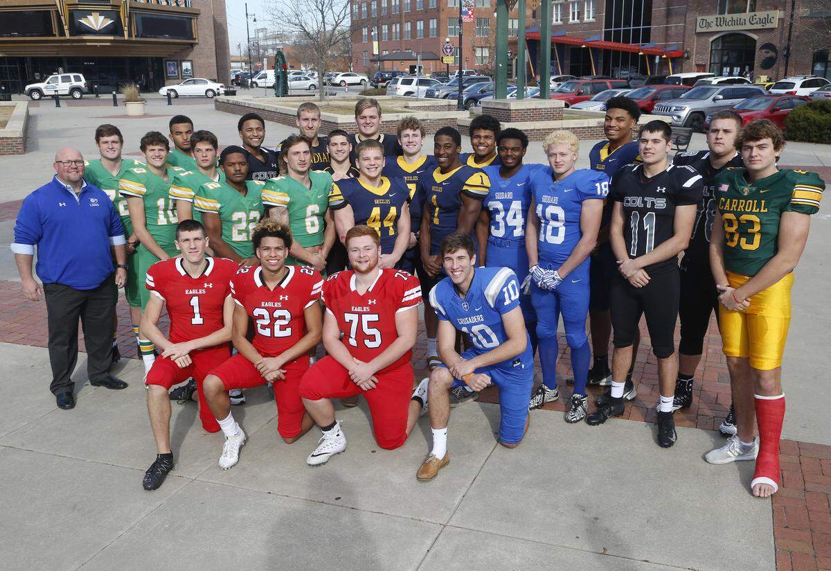 All metro football team from left : front row, Caleb Grill, Maize, Preven Christon, Maize, Nic Devore, Maize, Scott Valentas, Kapaun. Second row, Tom Beason, Goddard coach, Bryce Atkinson, Derby, Dax Benway, Derby, Hunter Igo, Derby, Tre Washington, Derby, Jackson Syring, Derby, Josh Carter, Northwest, Breece Hall, Northwest, Dhimani Butler, Goddard, Zeke Howell, Goddard, Tyler Kahman, Campus, Clay Cundiff, Bishop Carroll. Back row, Isaac Keener, Derby, Quinton Hicks, Campus, Mason Fairchild, Andale, Scott Easter, Andale, Cody Fayette, Maize South, Regan Jones, Northwest, Javon Wheeler, Northwest, Marcus Hicks, Northwest, Seth Falley, Campus. (November 28, 2018)