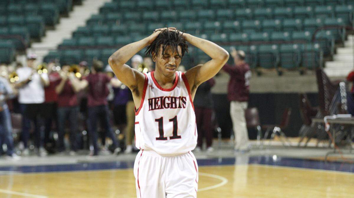 Heights senior guard Braxton Kirkendoll sulks after the Falcons' 54-46 loss to Salina Central in the first round of the 2018 Class 5A boys basketball tournament at the Kansas Expocentre in Topeka.