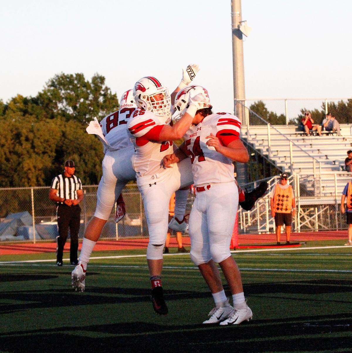 Maize junior running back Caden Cox celebrates with his teammates after scoring the first touchdown of the game in the Eagles’ 21-0 shutout of Campus on Friday night. (Sept. 14, 2018)