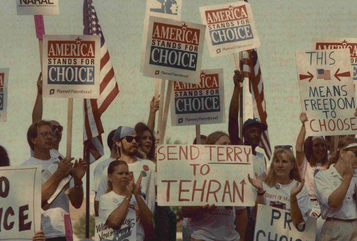 A group of abortion rights advocates cheer and clap during the Speak Out for Choice rally at A. Price Woodard Park during the summer of 1991.