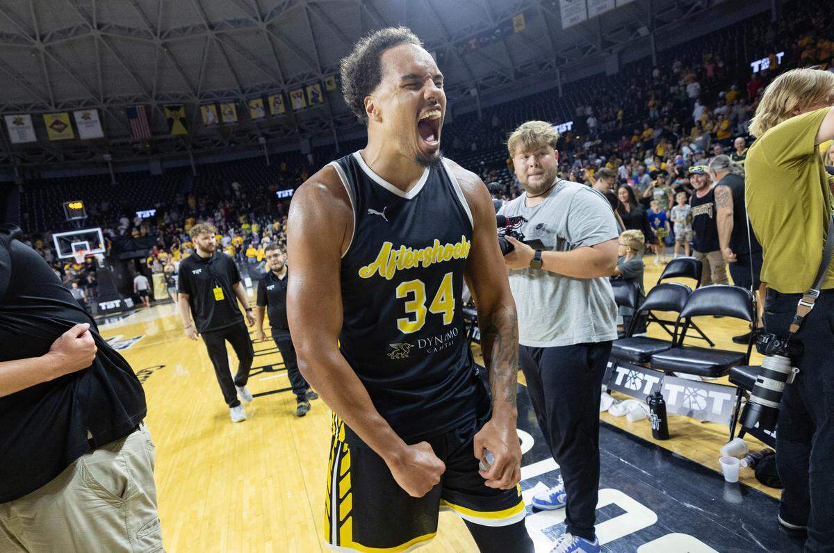 Marcus Santos Silva celebrates the Aftershocks 66-63 win over Forever Coogs on Tuesday night at Koch Arena.