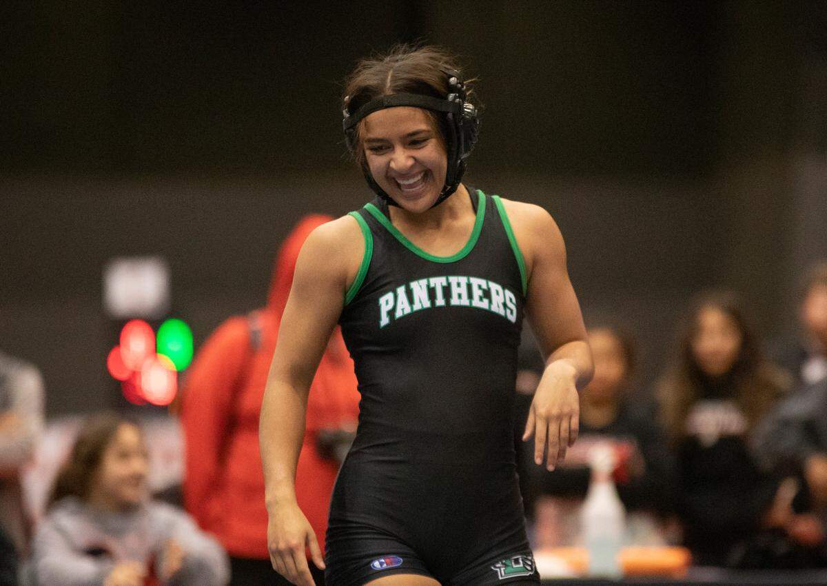 Derby’s Amara Ehsa celebrates winning 6-5A girls state wrestling on Thursday, Feb. 23, 2023.